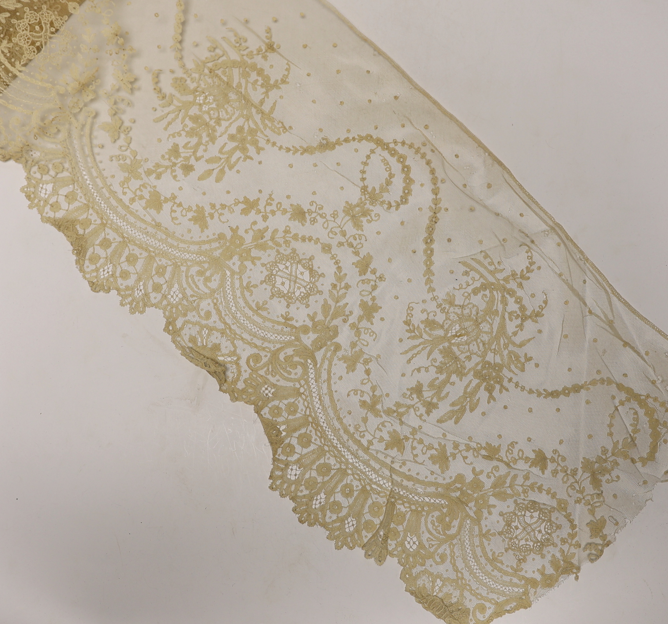 Late 19th century bobbin lace trimming: a length of mixed Brussels bobbin and needle lace trim, 255cm x 30cm and another length in the same design 126cm x 30cm together with a Honiton bobbin lace length 460cm x 50cm and